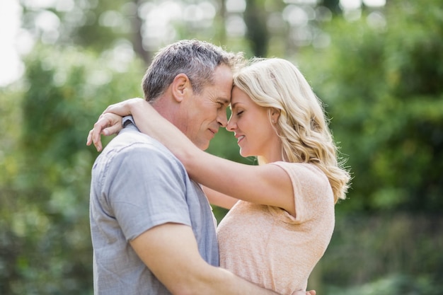 Cute couple hugging outside