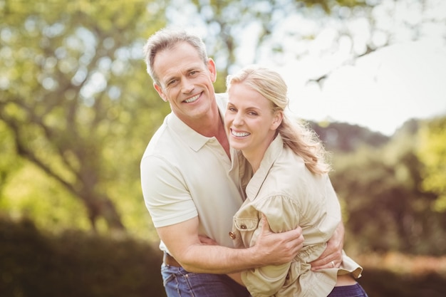 Cute couple hugging outside