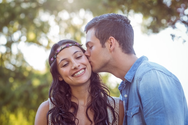 Cute couple kissing in the park