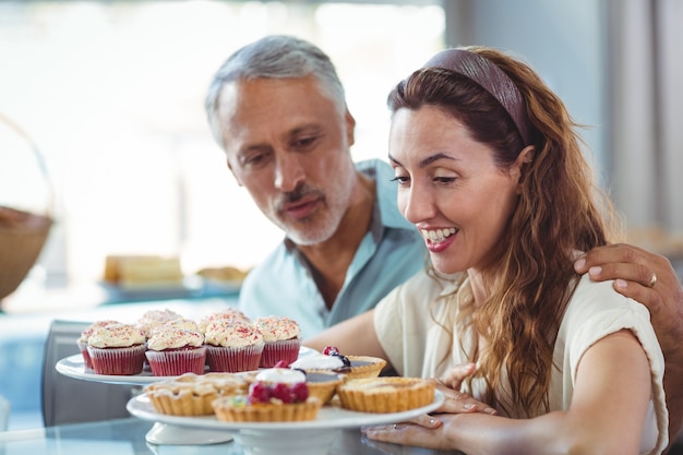 Cute couple looking at pastries