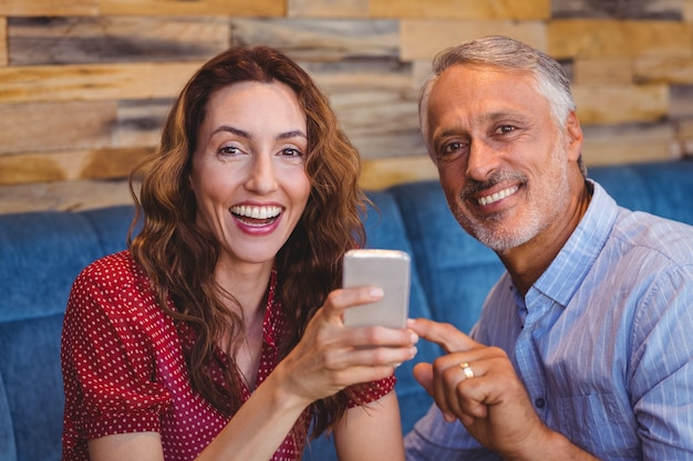 cute couple looking at their phones