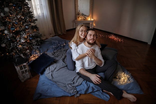 Cute couple near the Christmas tree