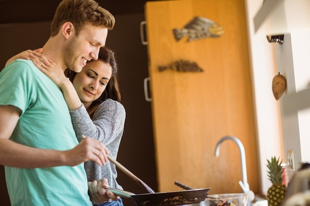 Cute couple preparing food together