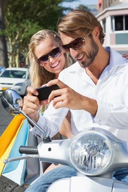 Cute couple riding a scooter