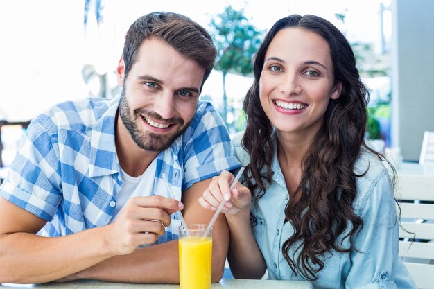 Cute couple sitting in cafe