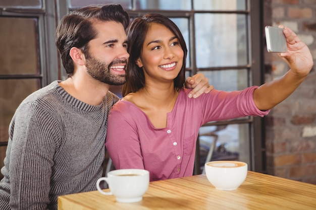 Cute couple taking selfie