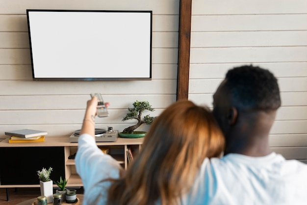 cute couple watching a movie on streaming service