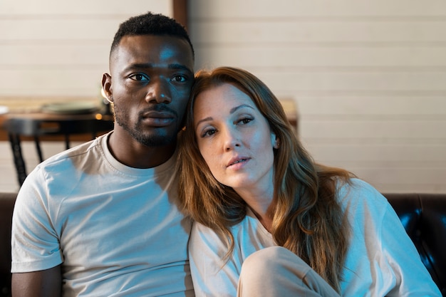 cute couple watching a movie on streaming service