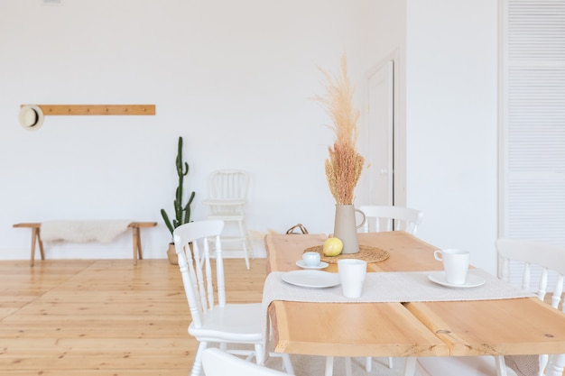 Cute cozy light interior design of the apartment