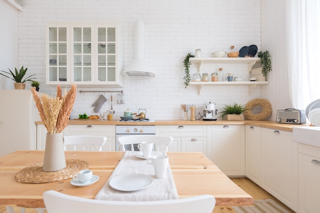 Cute cozy light interior design of the kitchen