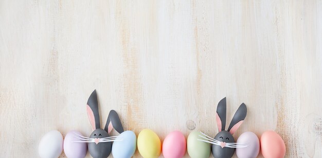 Cute creative photo with easter eggs, some eggs as the Easter Bunny