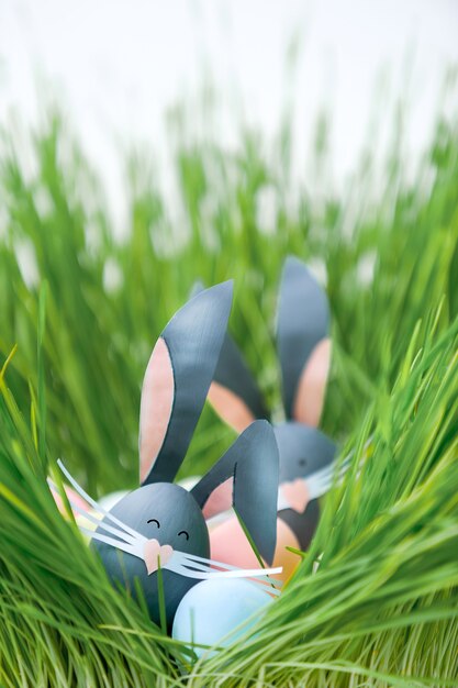 Cute creative photo with easter eggs, some eggs as the Easter Bunny