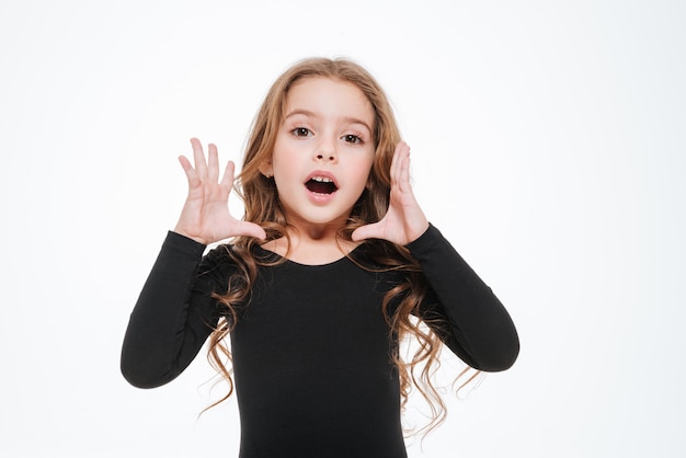 Cute curly little girl standing and calling for somebody