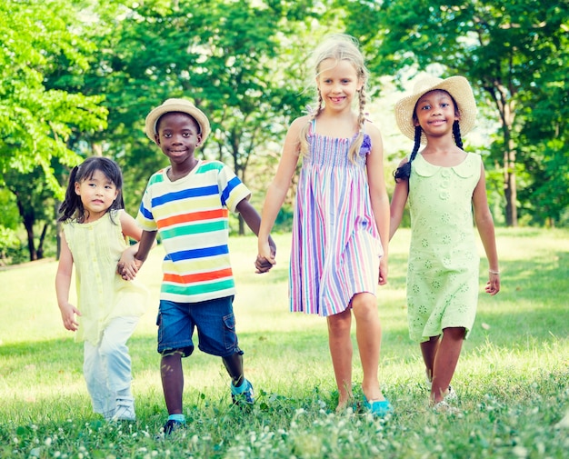 Cute diverse kids playing in the park