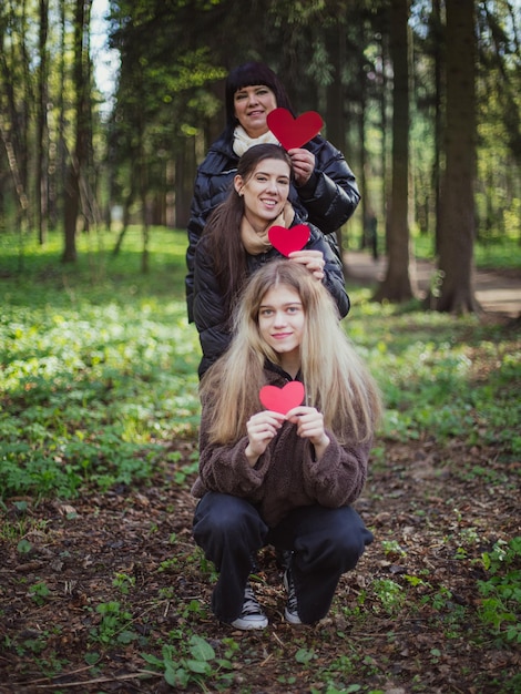 Cute family candid portrait of Mother with daughters