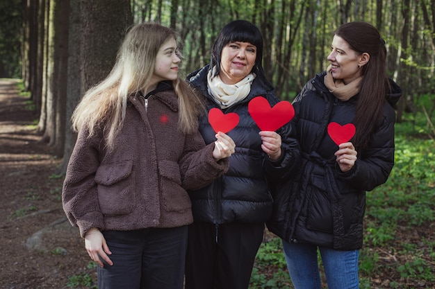 Cute family candid portrait of Mother with daughters