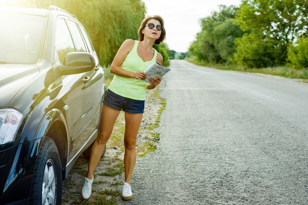 Cute female driver is traveling