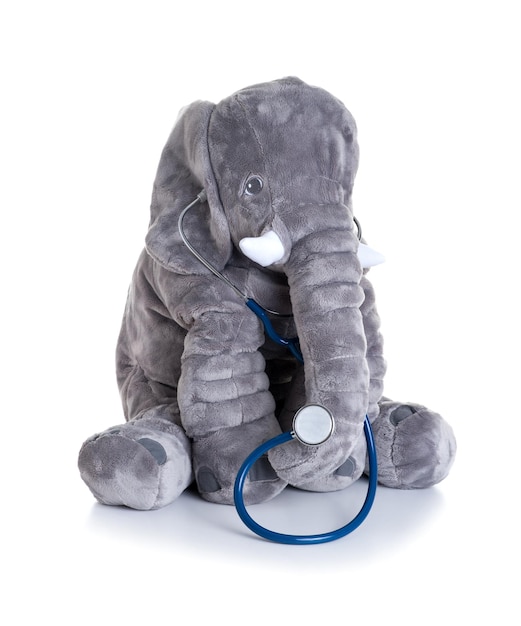 Cute fluffy elephant doll with stethoscope as a doctor isolated over white background