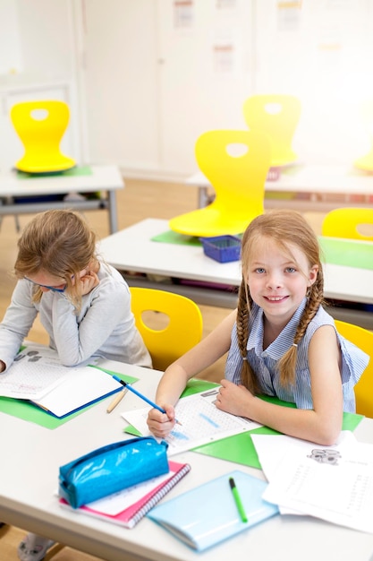 Cute friends studying in classroom