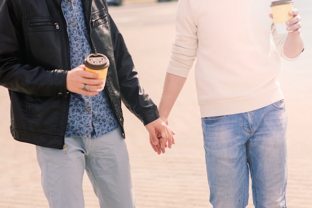 Cute gay couple in the city, tender gentle kissing, smiling