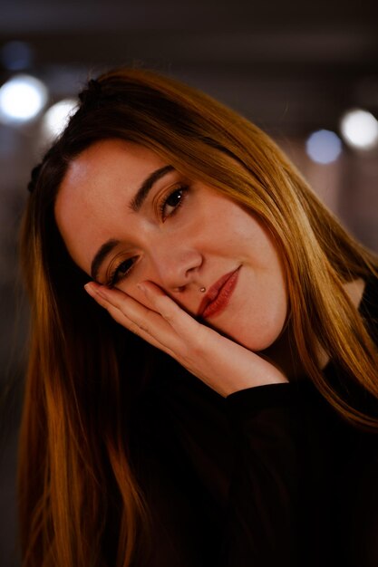 Cute ginger girl resting her face on her hand