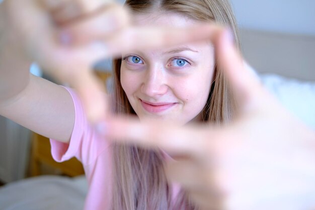 Cute girl 15-18 years old makes a selfie