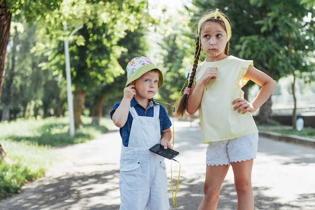 Cute girl and boy listening to music