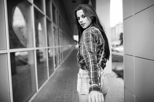 Cute girl in a clown makeup on a background black and white photo