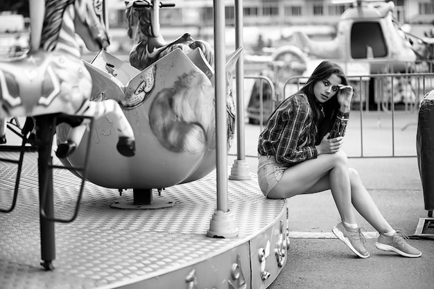 Cute girl in a clown makeup on a background black and white photo