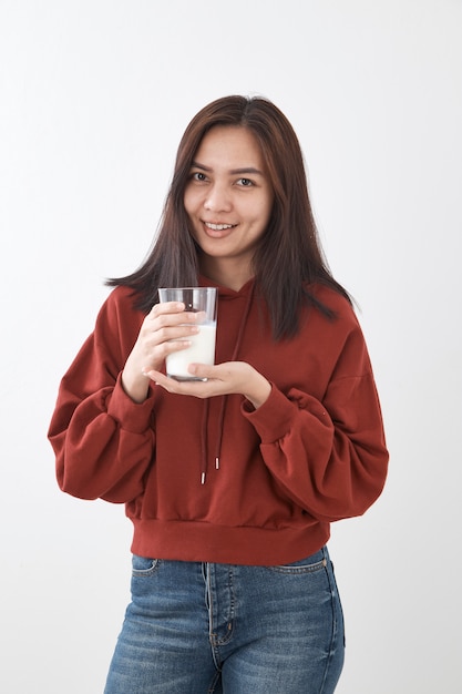 Cute girl drinks milk. portrait