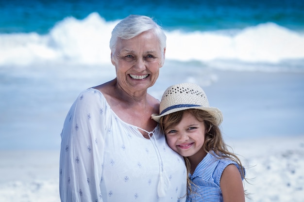 Cute girl embracing her grandmother