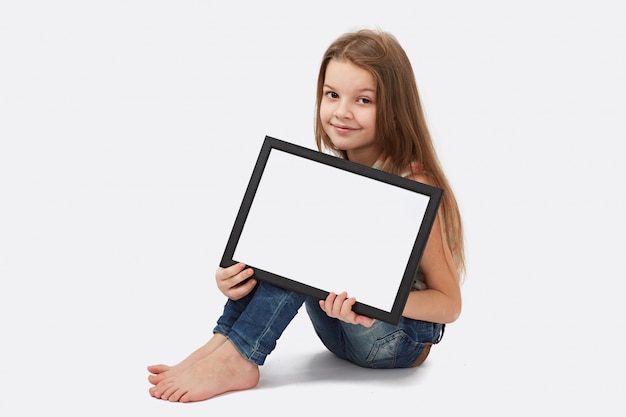 Cute girl holding a blank sign