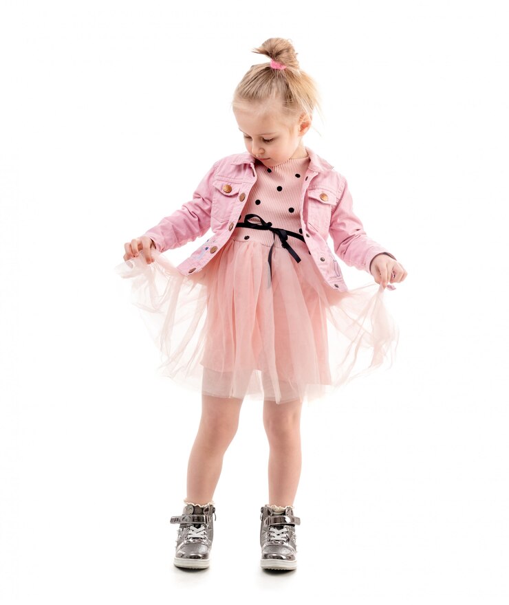 Cute girl holding her skirt, ready to dance