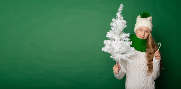 Cute girl is preparing for the new year in the background with gifts