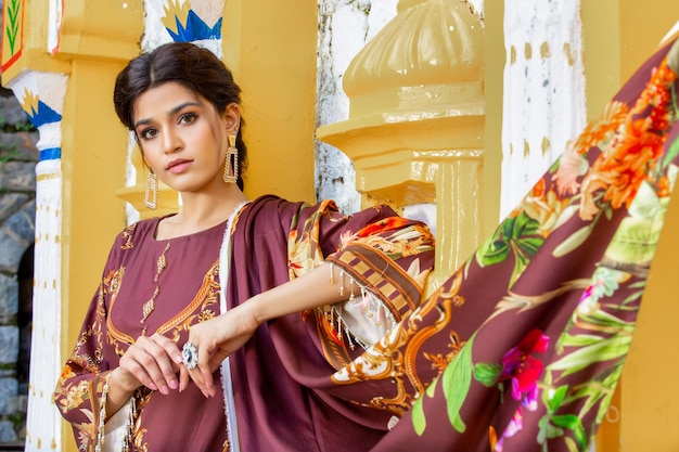 Cute Girl Landscape Wearing Traditional Floral Dress for Fashion Shoot at Ancient Place