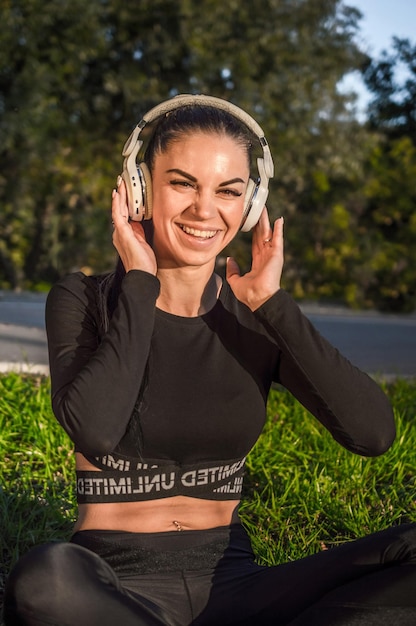 Cute girl listening to the music with headphonesBeautiful woman enjoys listening to music