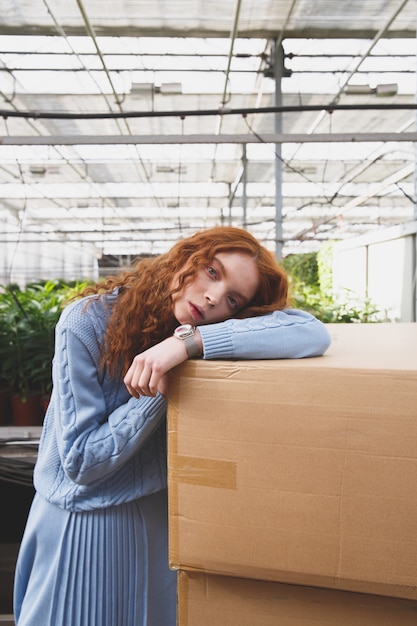 Cute girl lying on boxes