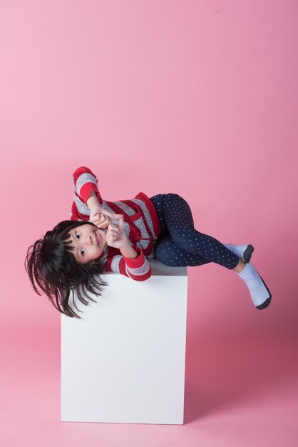 cute girl on pink background lovely kid