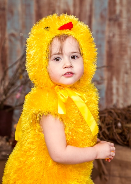 Cute girl play with real rabbit and duckling