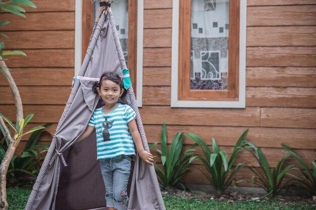 Cute girl playing in the backyard