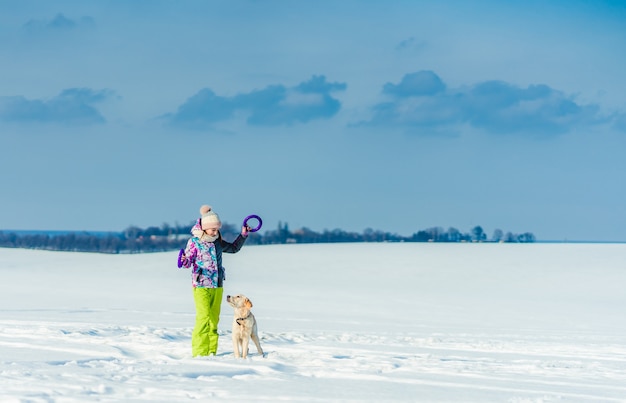 Cute girl playing with dog