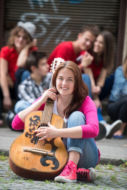 Cute girl posing with guitar