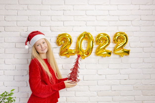 Cute girl preparing for the new year 2022