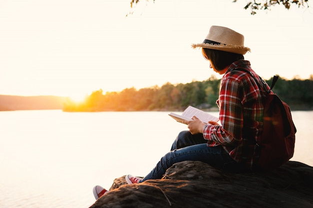 Cute girl reading a book .