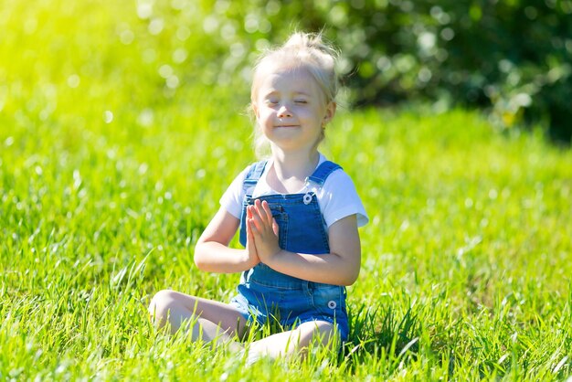 Cute girl sitting on field