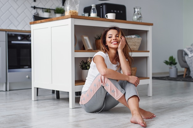 Cute girl sitting on the floor