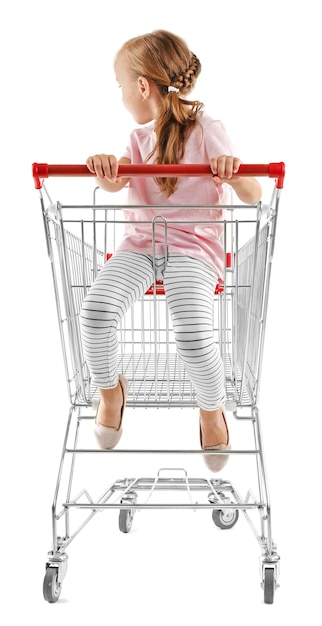 Cute girl sitting in shopping cart isolated