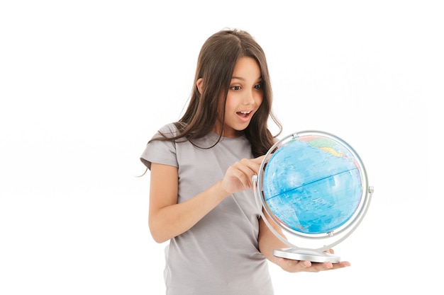 Photo cute girl standing isolated holding globe.