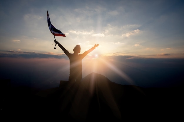 Cute girl turned back holding the flag