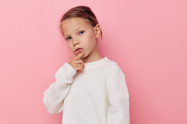 Cute girl white sweater posing fun childhood unaltered